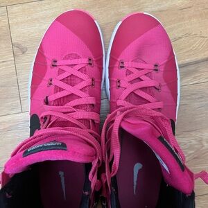 Hot pink Nike Hyperdunk 2015's. With breast cancer awareness ribbon on side.